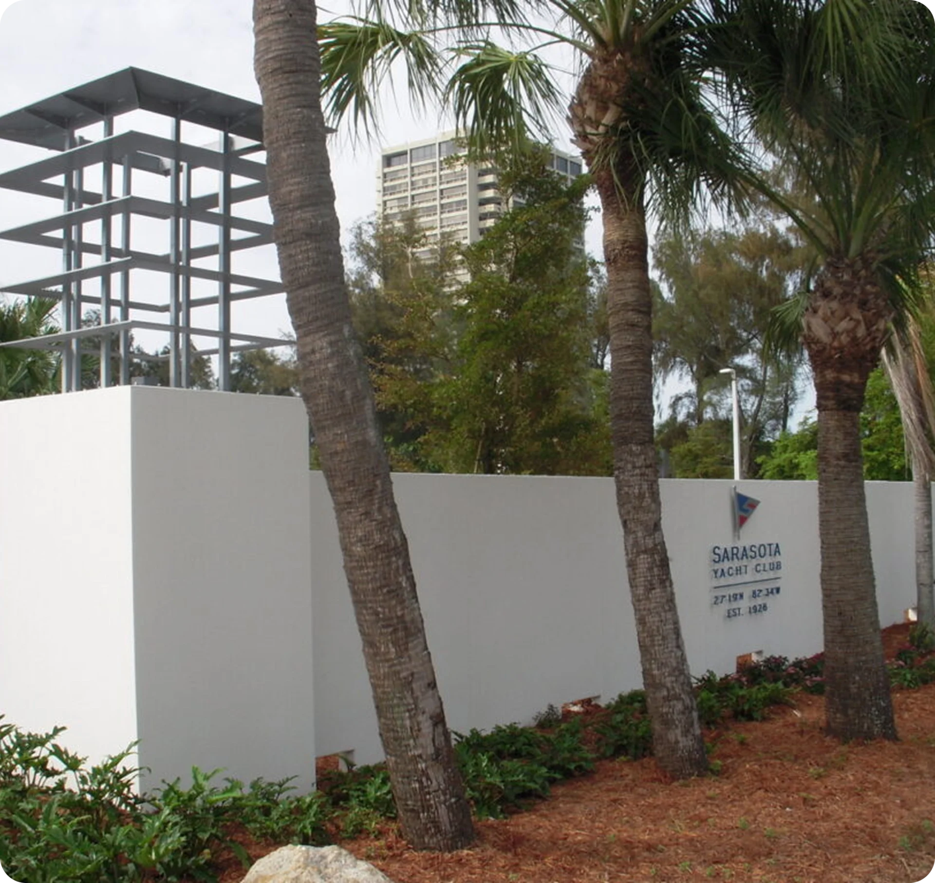 Sarasota Yacht Club entrance with palm trees.